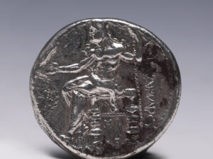 The Greek letter PΛ and KP are set in the filed at either side of the bird to indicate the mint.
