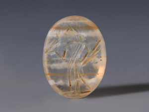 ancient roman intaglio of a figure holding a bird
