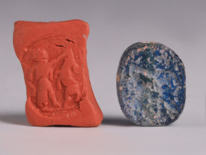 babylonian blue glass stamp seal combat scene