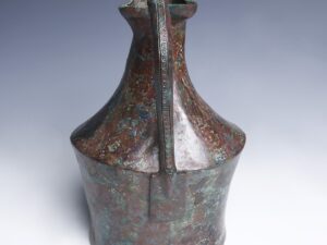 etruscan bonze vessel with snake handle