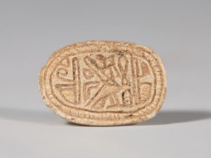 ancient egyptian scarab with hieroglyphs