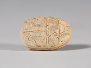 ancient egyptian scarab with hieroglyphs