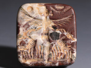 large neo assyrian agate stamp seal winged anthropomorphic figure ostriches