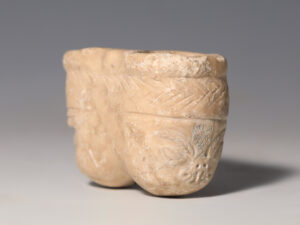 mesopotamian alabaster kohl jar with engraved ram heads 3