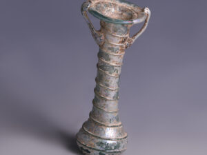 roman glass cosmetic flask with trail decorations