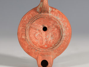 roman loeschcke type viii oil lamp with ovolo shoulder and foliage motif 4
