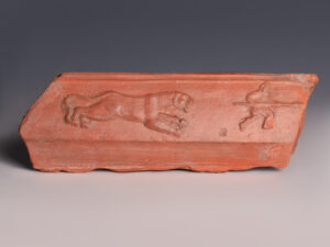 roman red slipware plaque with lioness and hunter