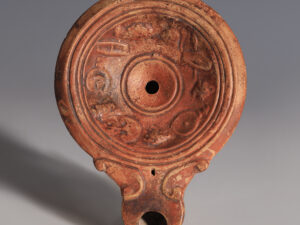 roman terracotta oil lamp with military equipment