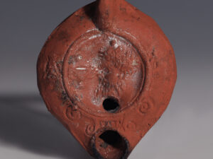 roman terracotta oil lamp with silenus