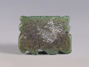 egyptian faience wedjat eye amulet surrounded by uraei