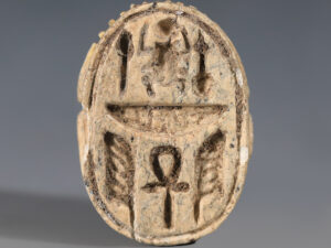 a large egyptian steatite scarab with apotropaic hieroglyphs