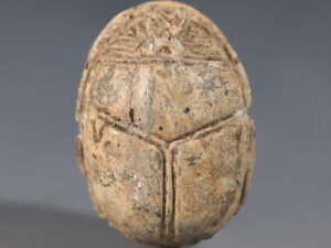 a large egyptian steatite scarab with apotropaic hieroglyphs