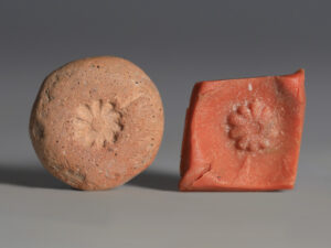ancient egyptian terracotta daisy amulet mould