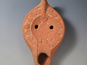 late roman early byzantine terracotta oil lamp with a saint praying