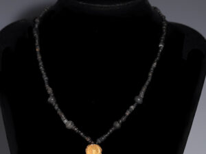 ancient roman black glass beaded necklace with gold pendant
