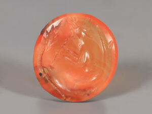 ancient roman carnelian intaglio of a flute player