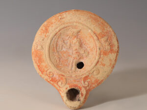 ancient roman terracotta oil lamp with fisherman