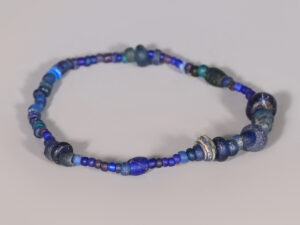 selection of ancient roman dark blue glass beaded bracelets