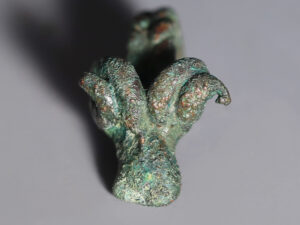 selection of bronze age bronze ram-head pendants 2