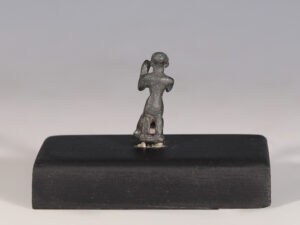 ancient egyptian bronze figurine of a kneeling priest